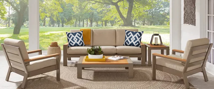 beige outdoor sofa set with mustard and indigo accents