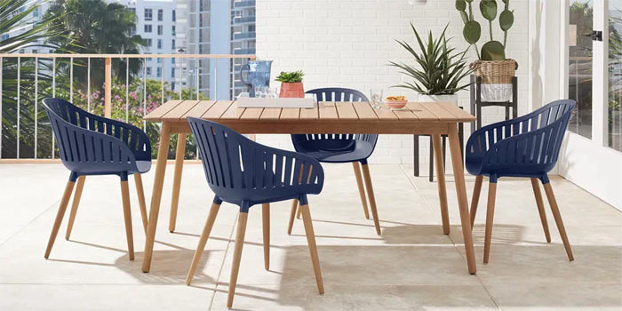Midcentury modern balcony dining set in blue with white accents.