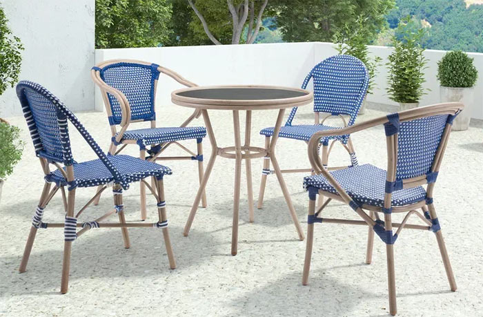 Quaint bistro set in royal blue and white wicker.