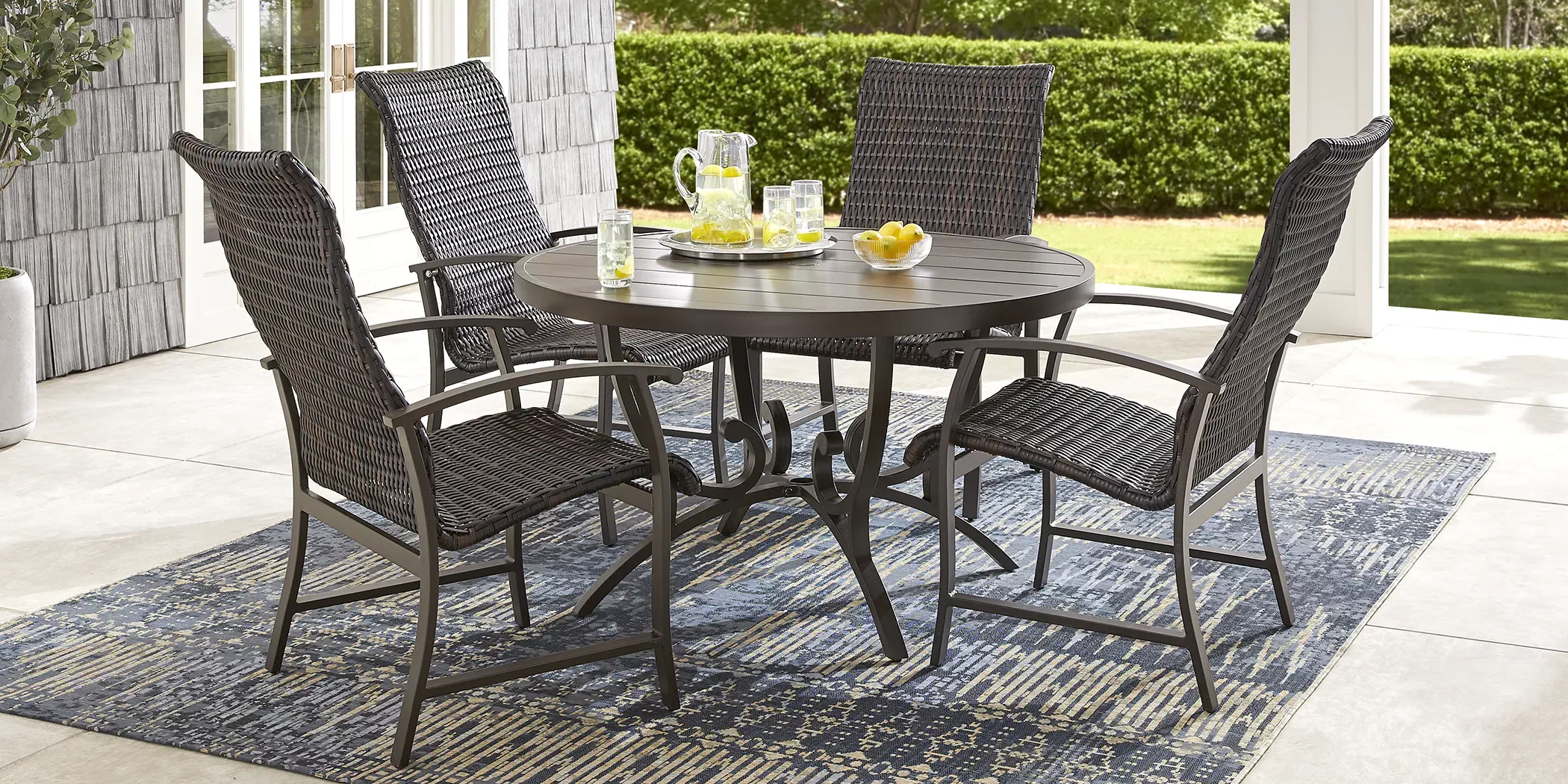 black and wicker patio dining