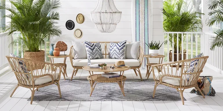 wicker porch with wall art, sculpture and planters