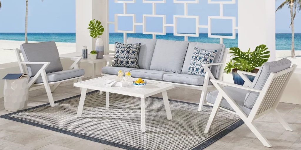 White 4 piece outdoor seating set on a rug