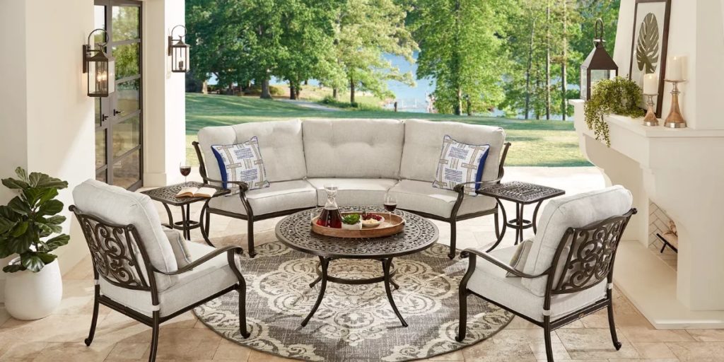 bronze curved sectional with matching chairs and table