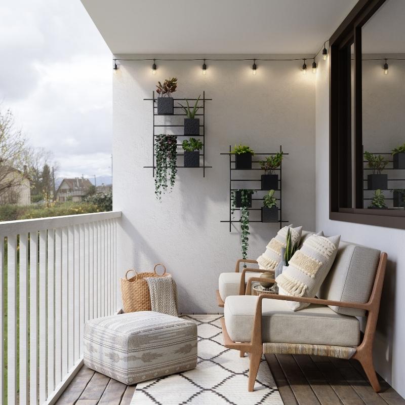photo of a balcony with wooden patio chairs and a fabric ottoman