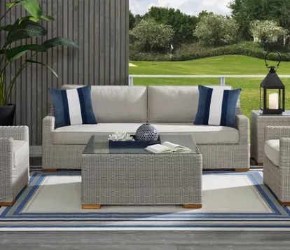 patio set staged around a white and blue rug