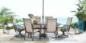 Image of a patio dining set on top of a large outdoor rug