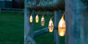 Outdoor string lights on a fence