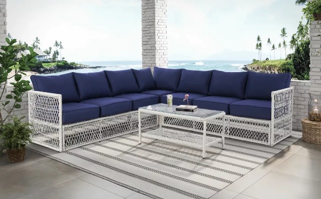 navy blue sectional with white wicker base