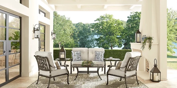 Bronze patio seating set with white cushions